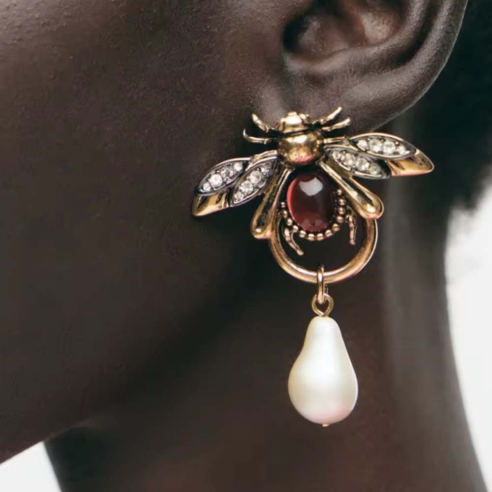 NEW Anthropology bee 
Gold and Red Bee Drop Earrings